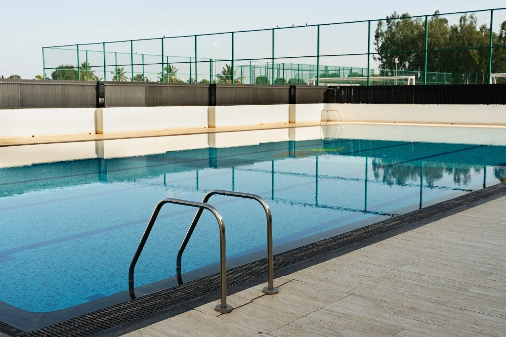 The school swimming pool with a metal ladder